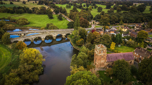 High angle view of bridge over river amidst trees