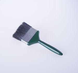 High angle view of paintbrush on gray background