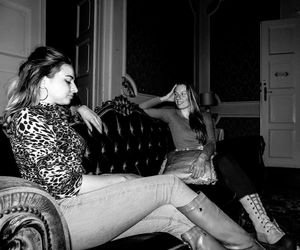 Side view of young woman sitting at home