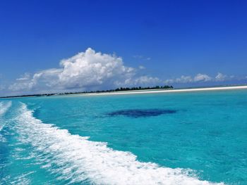 Scenic view of sea against blue sky