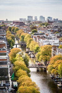 High angle view of river passing through city