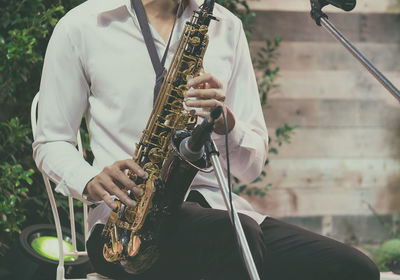 Low angle view of man playing guitar