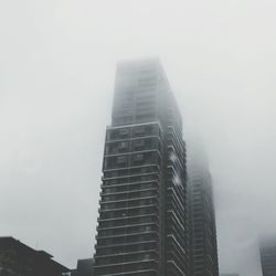 Low angle view of skyscrapers against sky