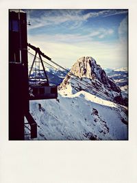 Scenic view of mountains against cloudy sky