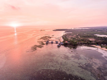 Scenic view of beach against sky during sunset