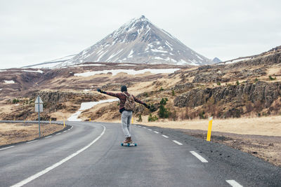 Man skateboarding on highway