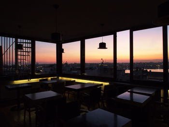 Interior of restaurant against sky during sunset