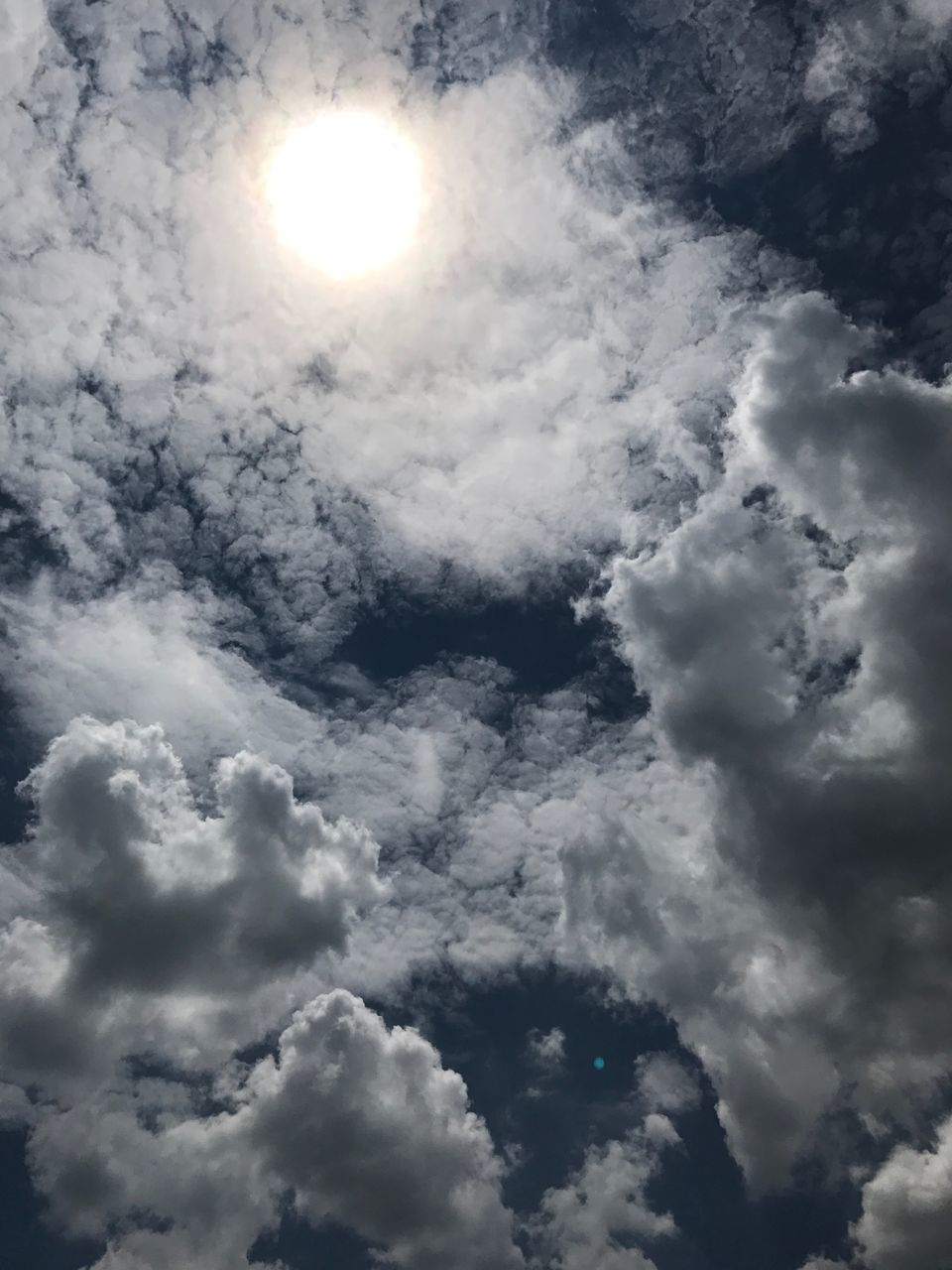 sky, nature, cloud - sky, beauty in nature, low angle view, sky only, sun, tranquility, majestic, scenics, backgrounds, cloudscape, weather, no people, outdoors, full frame, day, tranquil scene