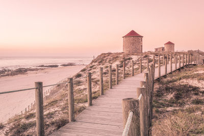 Scenic view of sea against clear sky during sunset