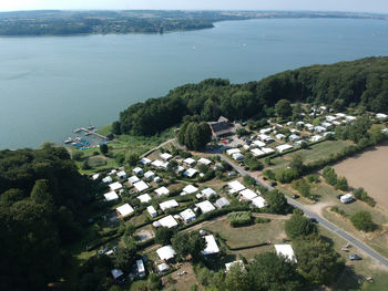 High angle view of buildings by sea