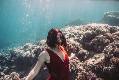 Rear view of woman looking at sea