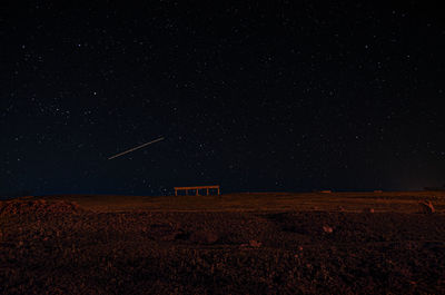 Scenic view of landscape against sky at night