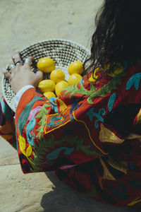 High angle view of man with lemon in traditional clothing