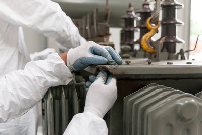 Cropped image of workers working in factory