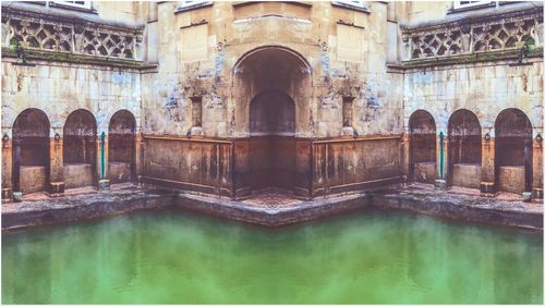 Reflection of old building in water