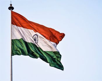 Low angle view of flag against clear sky