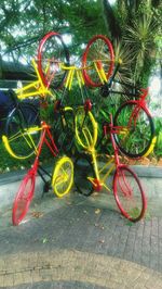 Colorful bicycle parked by tree