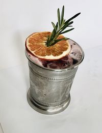 High angle view of drink on table against white background