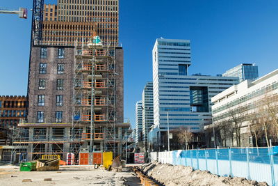 Modern buildings against clear blue sky