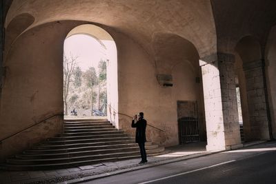 Man walking on staircase of building