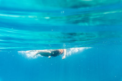 Person swimming in sea