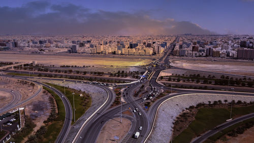 High angle view of vehicles on road against sky