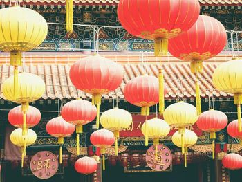 Low angle view of lanterns hanging in row