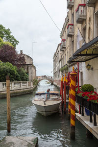 Boats moored in canal