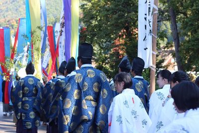 Rear view of people in traditional clothing