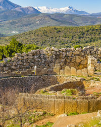 View of stone wall with mountain in background