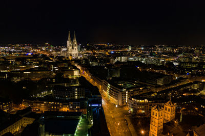 High angle view of illuminated buildings in city at night
