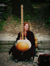 Young woman playing guitar