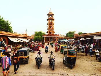 Group of people in front of clock tower