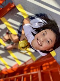 High angle view portrait of cute boy outdoors