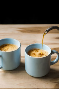 Close-up of drink in cup on table