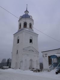 Building against sky during winter