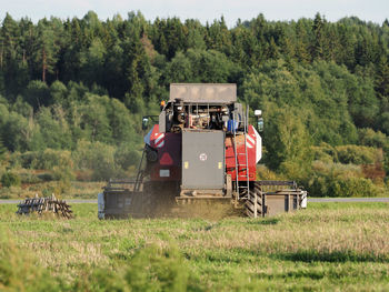 Combine harvester traka, clover field russia. agricultural industry, food crisis agro-industry