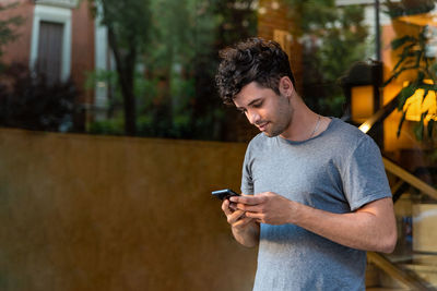 Young man using mobile phone