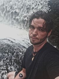 Portrait of young man in sea