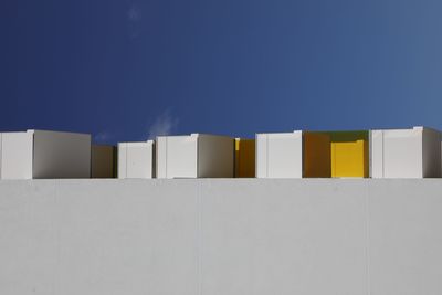 Low angle view of building against blue sky