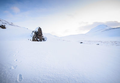 Snow covered mountain against sky