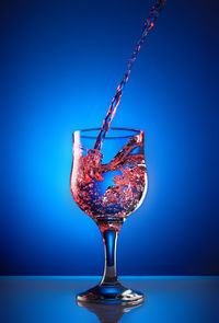 Close-up of drink over black background