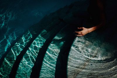 High angle view of man swimming in pool