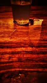 Close-up of beer glass on table