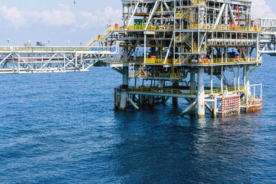 Pier over sea against sky