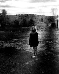 Full length of woman standing in water