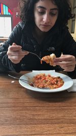 Young woman eating food