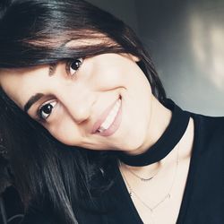 Close-up portrait of a smiling young woman