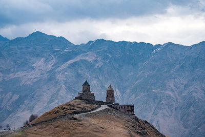 View of a building with mountain range in the background