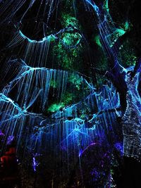 Close-up of illuminated lighting equipment at night